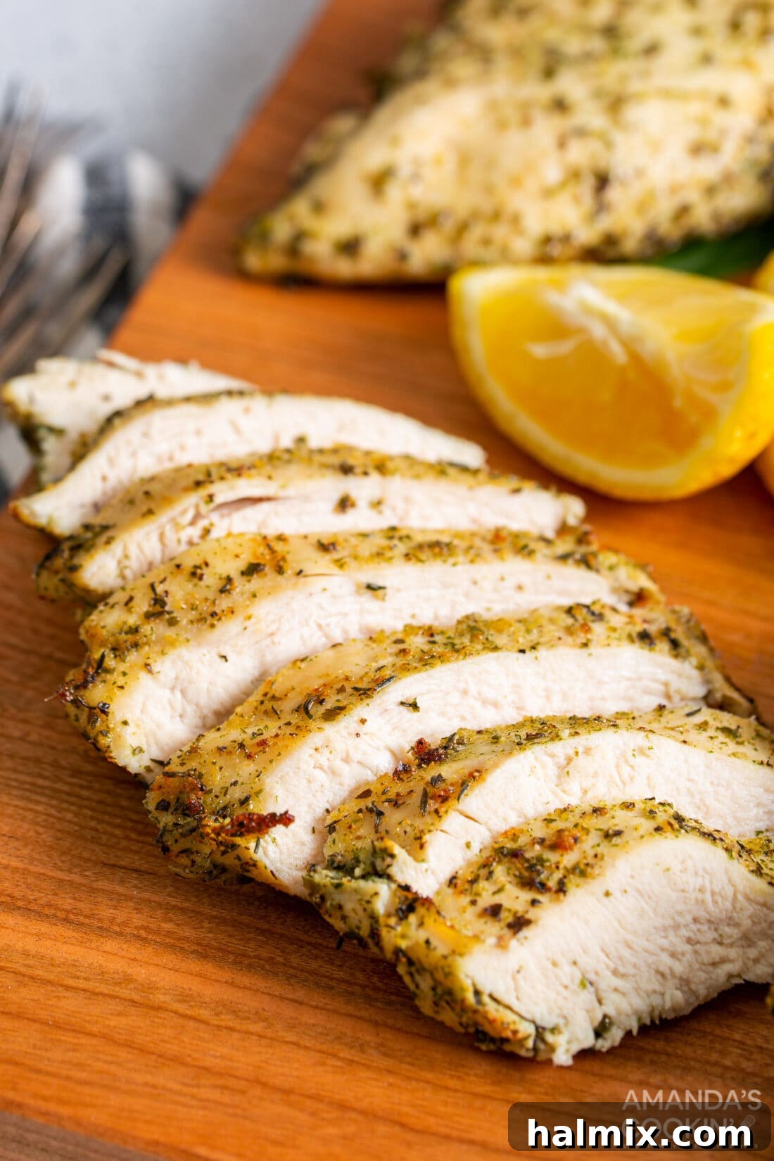 Perfectly sliced air fryer chicken breasts, showcasing their juicy interior