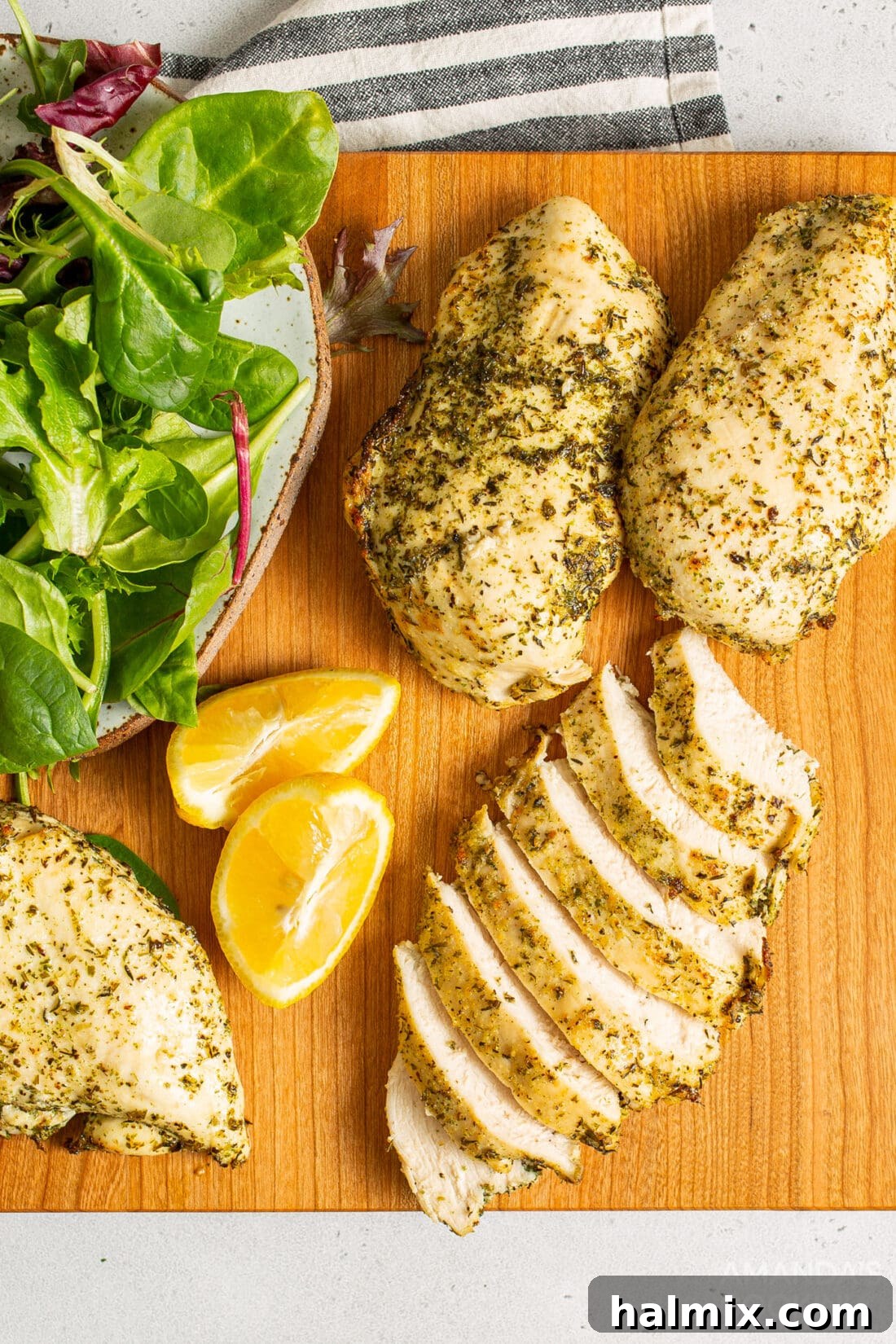 Perfectly cooked air fryer chicken breasts on a cutting board, ready to be sliced for dinner