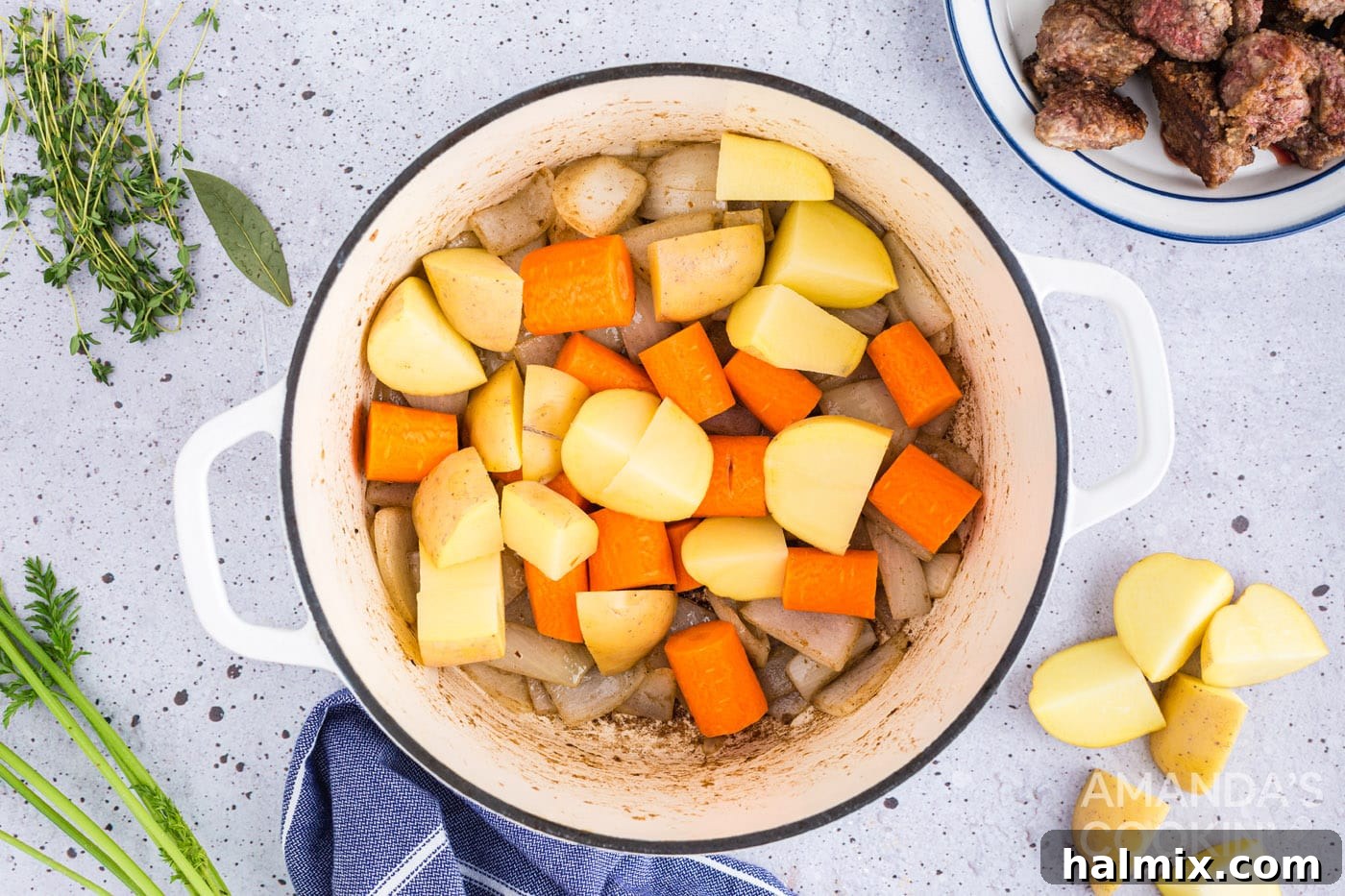 add potatoes and carrots to the pot