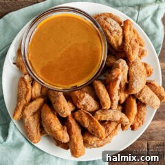 plate of air fryer apple fries with caramel sauce