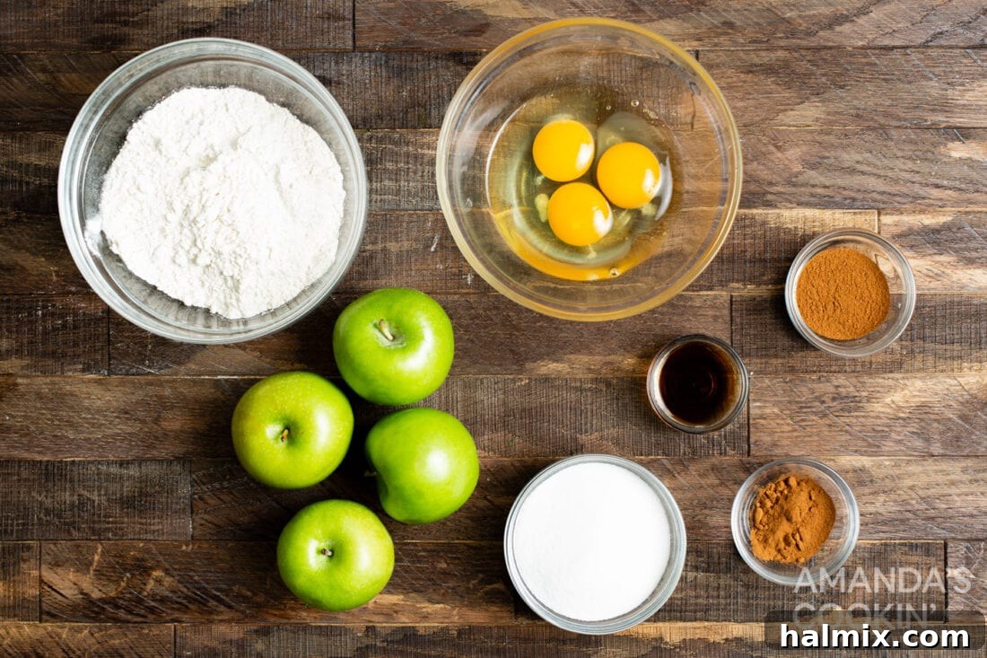 A flat lay showing all ingredients for making Air Fryer Apple Fries: apples, flour, spices, eggs, sugar, and cinnamon.