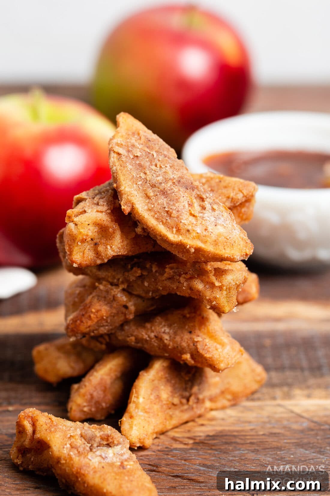 A generous pile of golden Air Fryer Apple Fries dusted with cinnamon sugar, ready to be enjoyed.