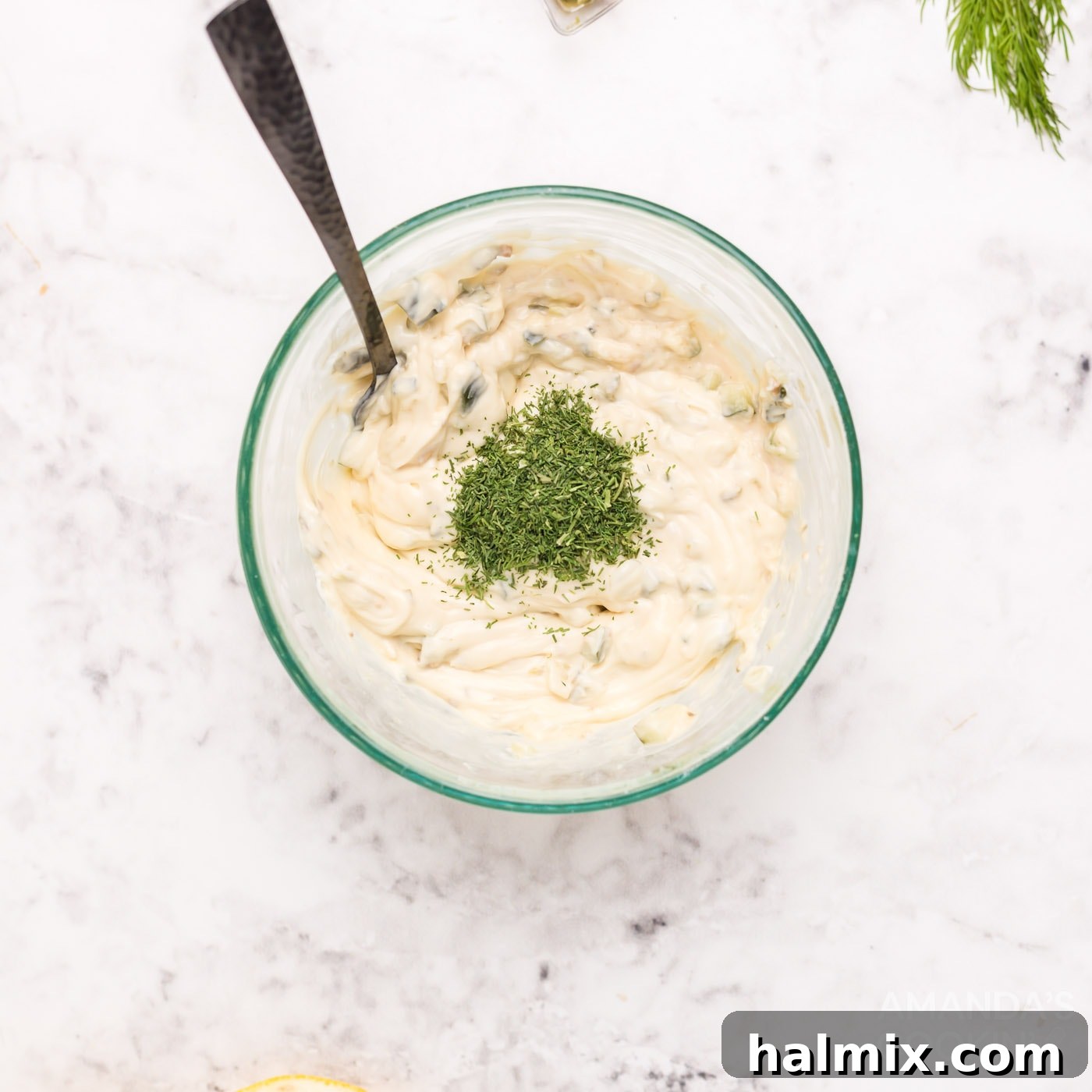 Ingredients for tartar sauce combined in a small bowl, ready for mixing.