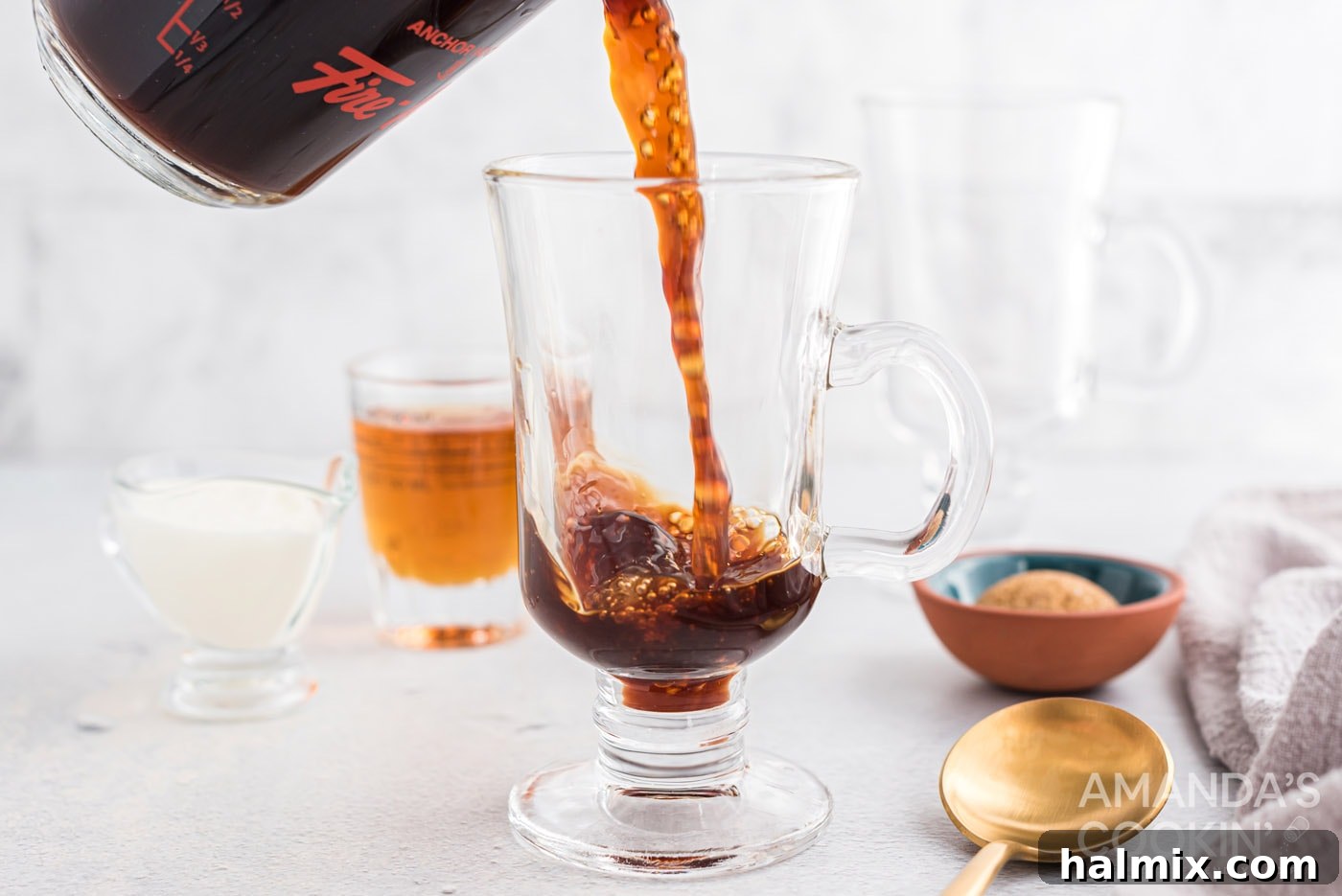 pouring coffee into glass mug
