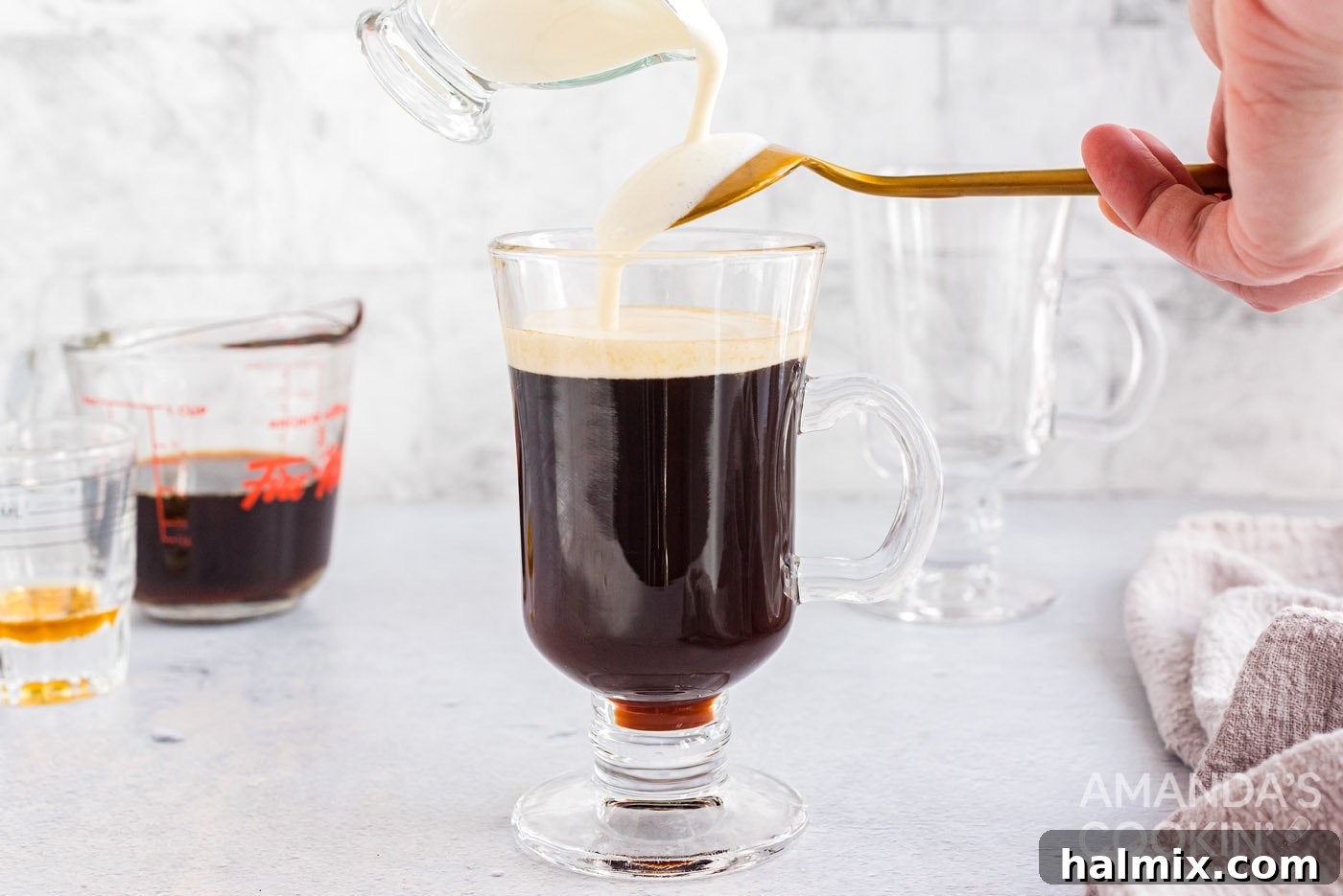 pouring thickened cream over the back of a spoon