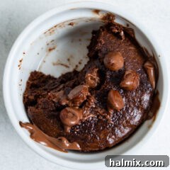 Air fryer brownie with a bite taken out, indicating its irresistible nature.