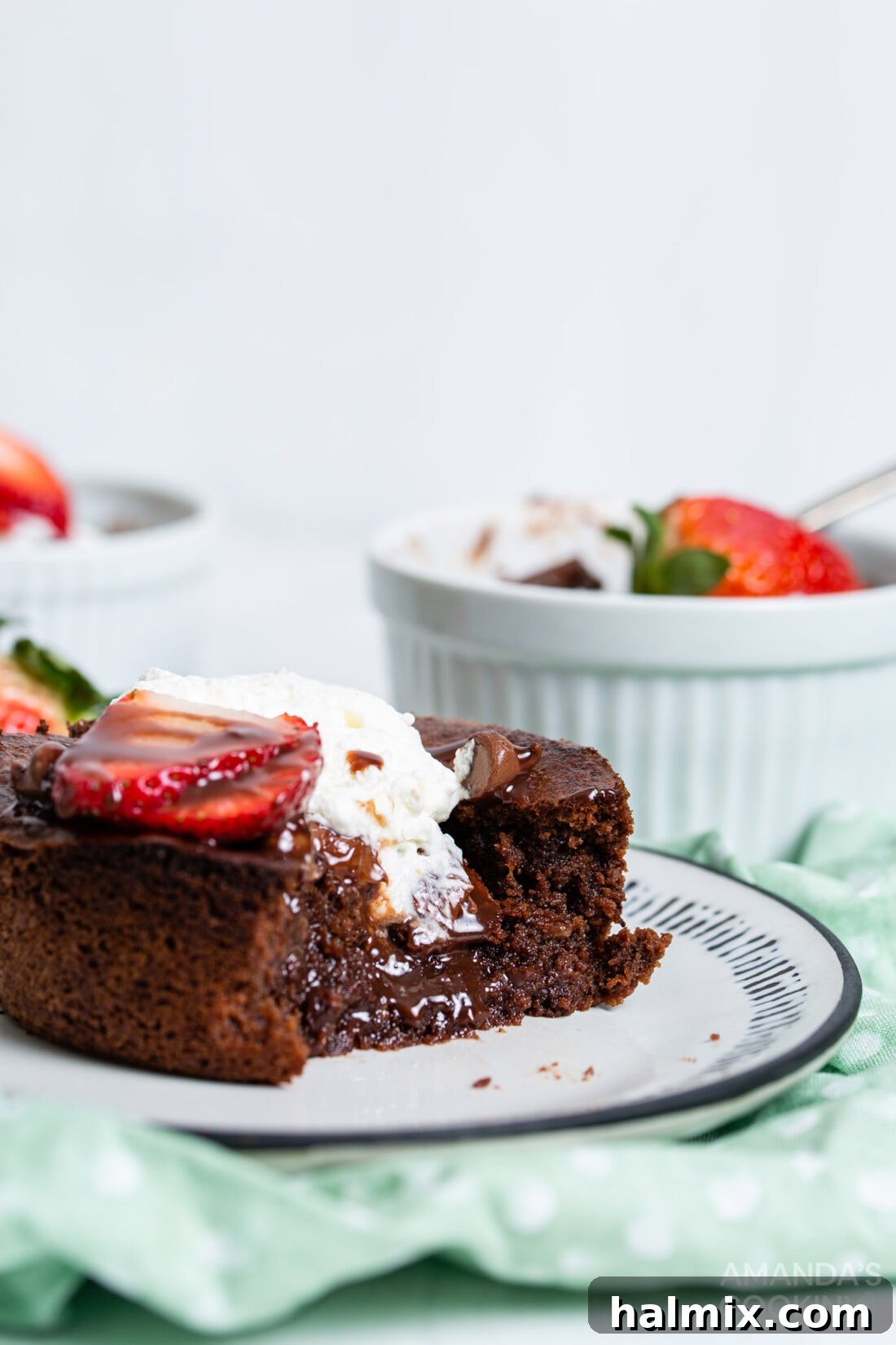 A perfectly baked air fryer brownie with a bite taken out, revealing its rich, fudgy interior, highlighting its delicious texture.
