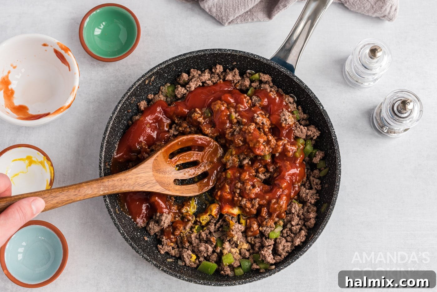 Messy Beef Bliss 8 The sloppy joe mixture being thoroughly stirred to combine all ingredients before simmering.
