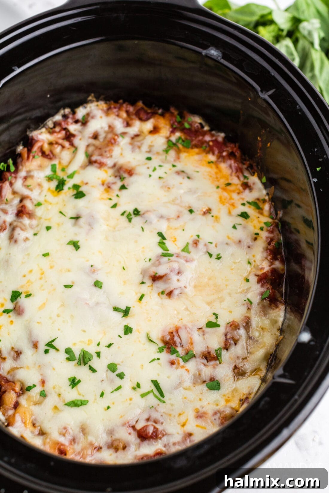 Effortless Slow Cooker Lasagna 2 Delicious crockpot lasagna in a slow cooker, ready to serve