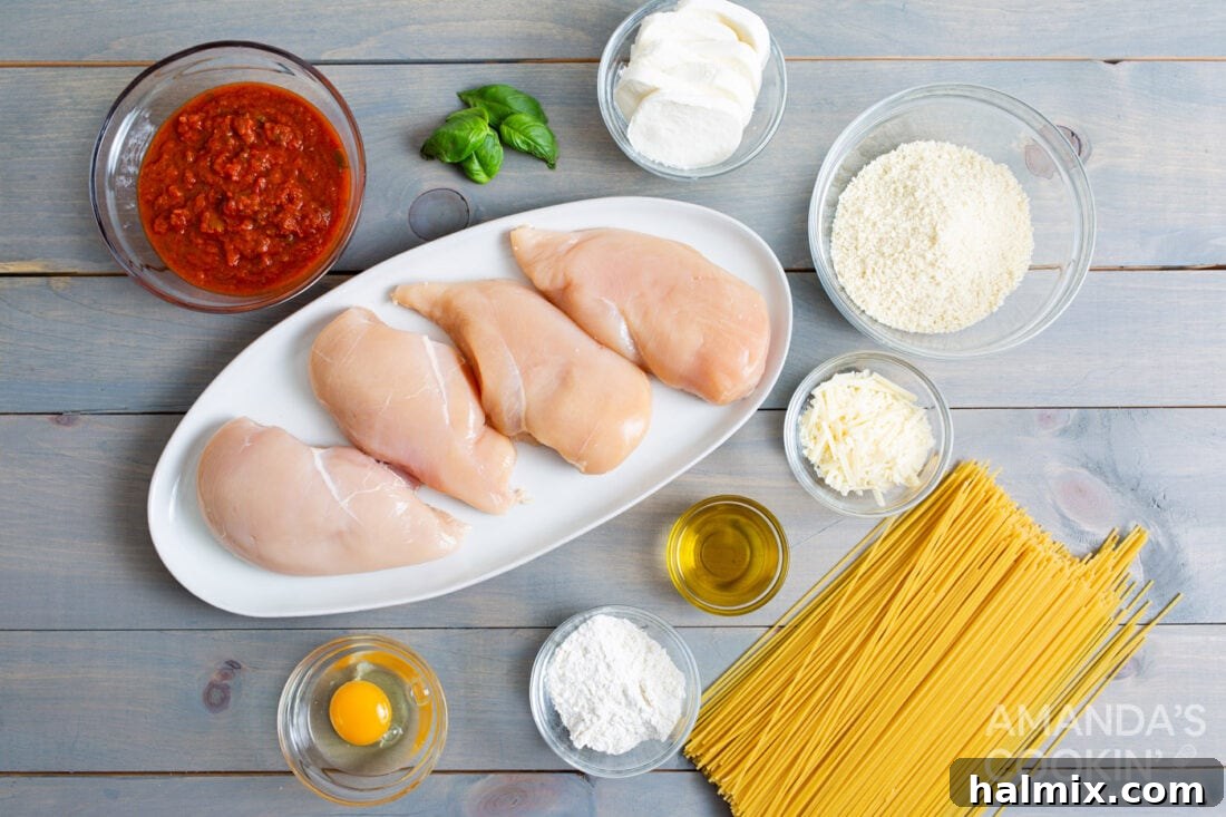Crispy Air Fryer Chicken Parmesan 5 All ingredients laid out for preparing air fryer chicken parmesan