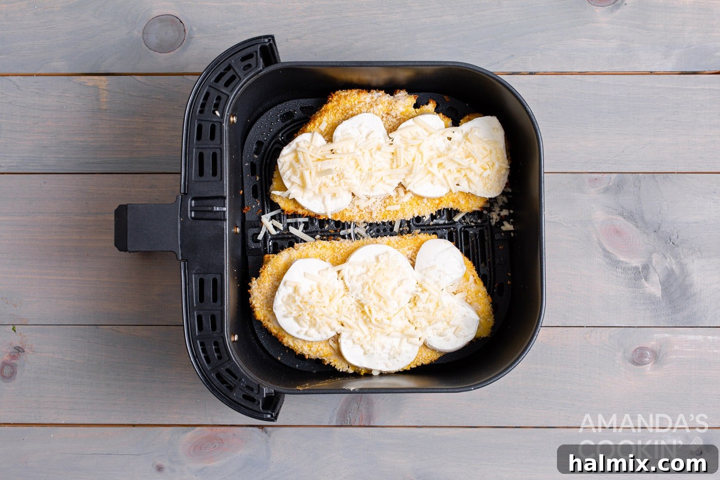 Crispy Air Fryer Chicken Parmesan 10 Melted mozzarella and parmesan cheese on chicken in the air fryer