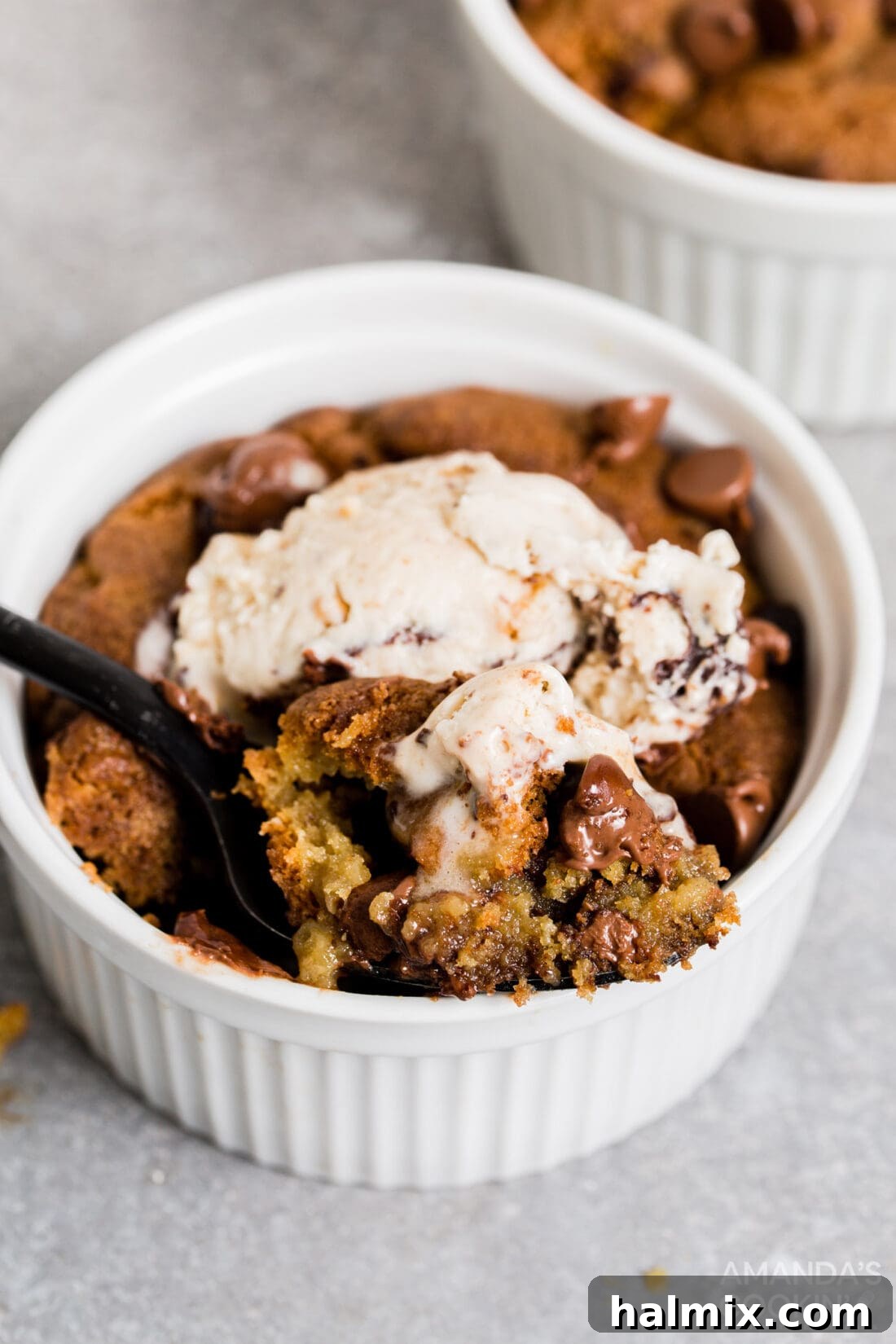 air fryer chocolate chip cookies in a ramekin with ice cream