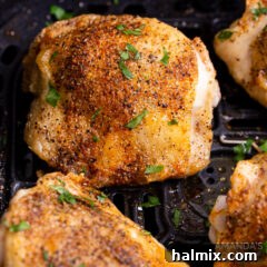 close-up of crispy air fryer chicken thighs on a plate