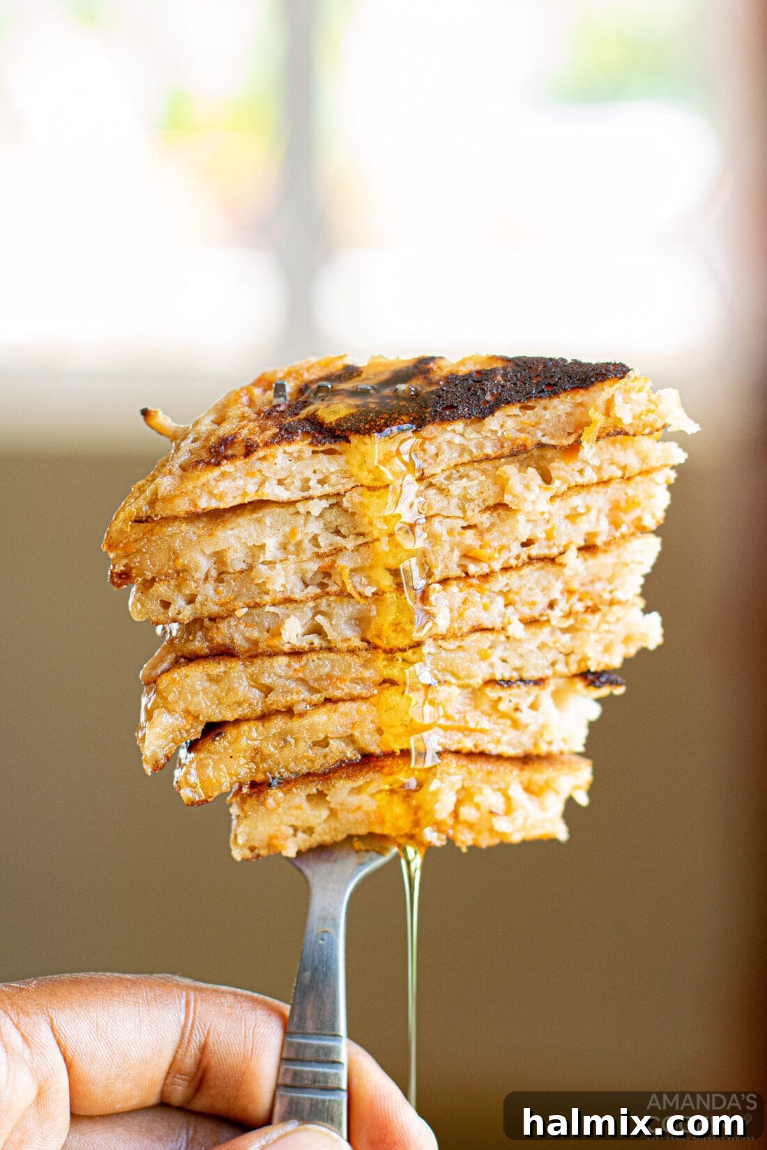 sliced carrot cake pancakes on a fork