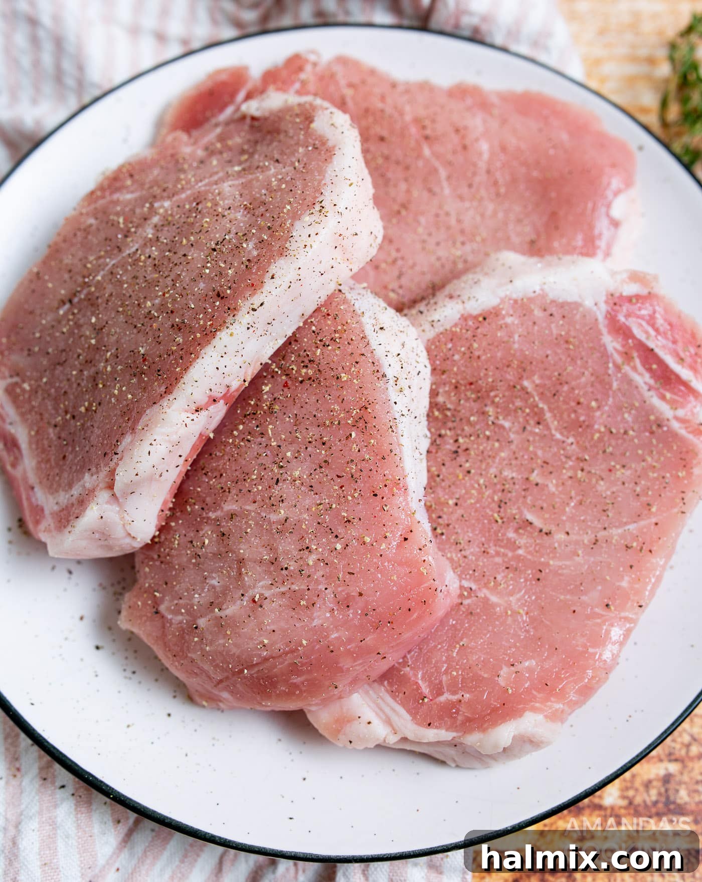 Pork chops seasoned with salt and pepper