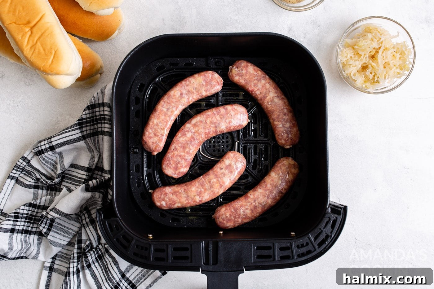 Perfect Air Fryer Bratwurst 5 bratwurst in an air fryer tray
