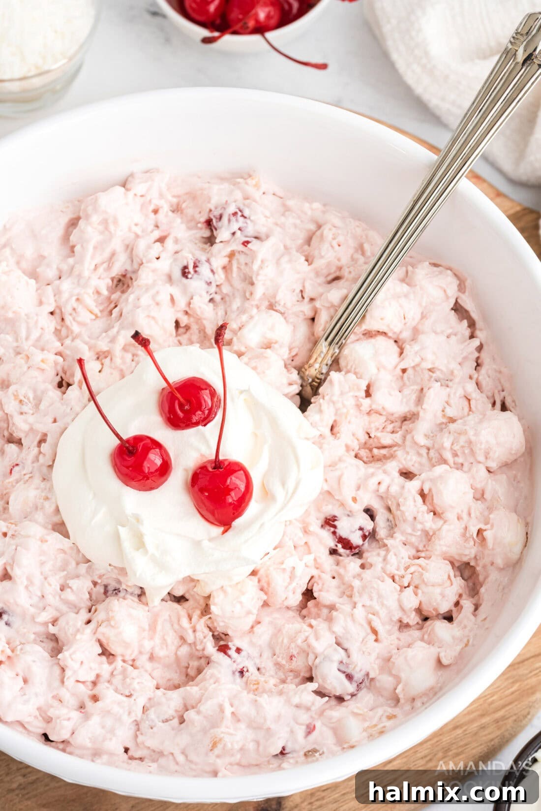 Ruby Cloud Delight 2 Large bowl of homemade cherry fluff dessert, garnished beautifully.