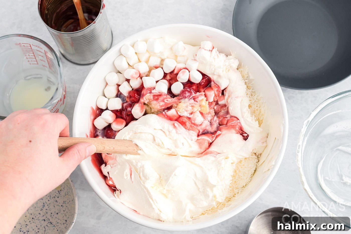 Ruby Cloud Delight 6 Mixing all ingredients in a bowl to create cherry fluff.