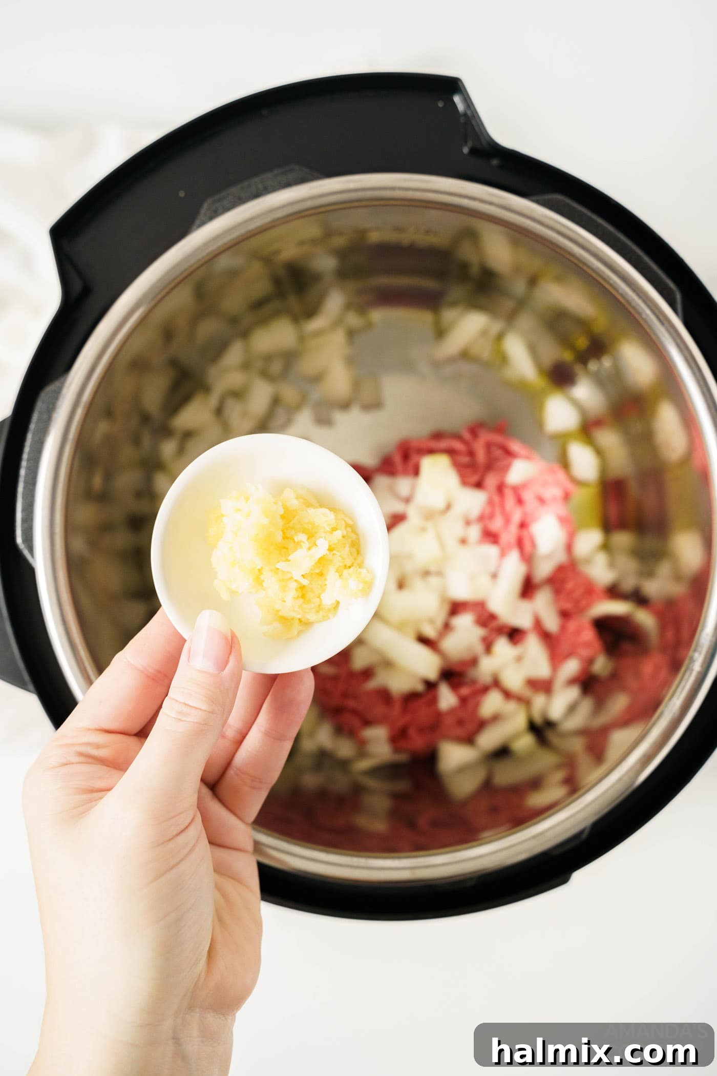 Effortless Instant Pot Spaghetti with Rich Meat Sauce 5 Sautéing onion, ground beef, and garlic in the Instant Pot