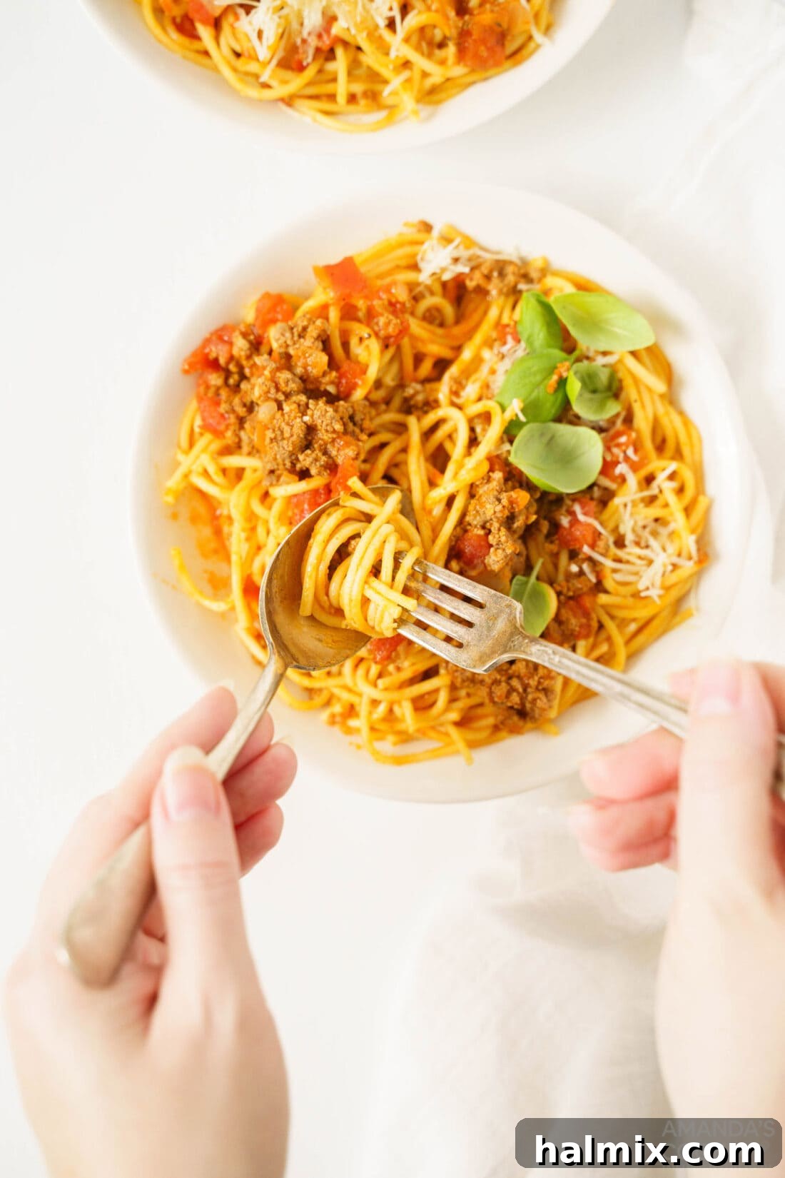 Effortless Instant Pot Spaghetti with Rich Meat Sauce 8 A fork twirling a generous portion of Instant Pot Spaghetti and Meat Sauce, ready to be eaten