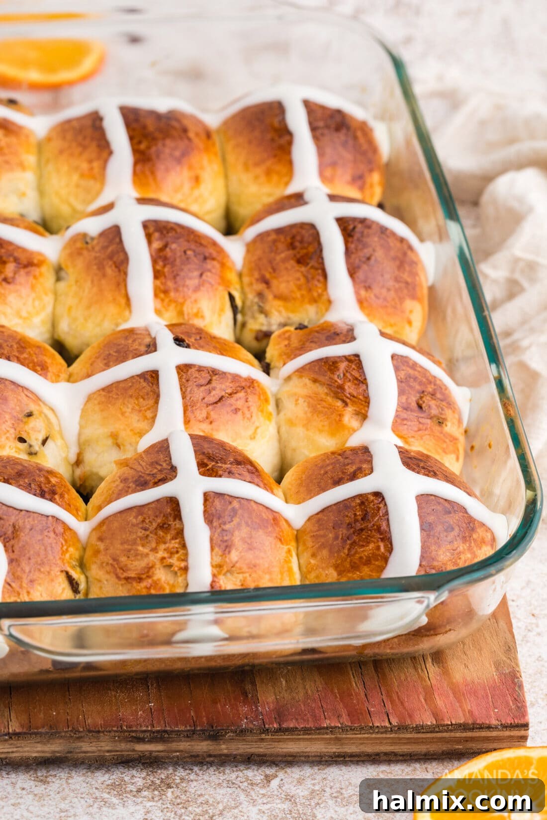 Spiced Easter Delights 19 A glass pan filled with golden brown Hot Cross Buns
