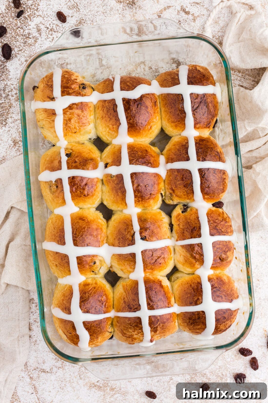 Spiced Easter Delights 3 Hot Cross Buns arranged in a glass baking dish