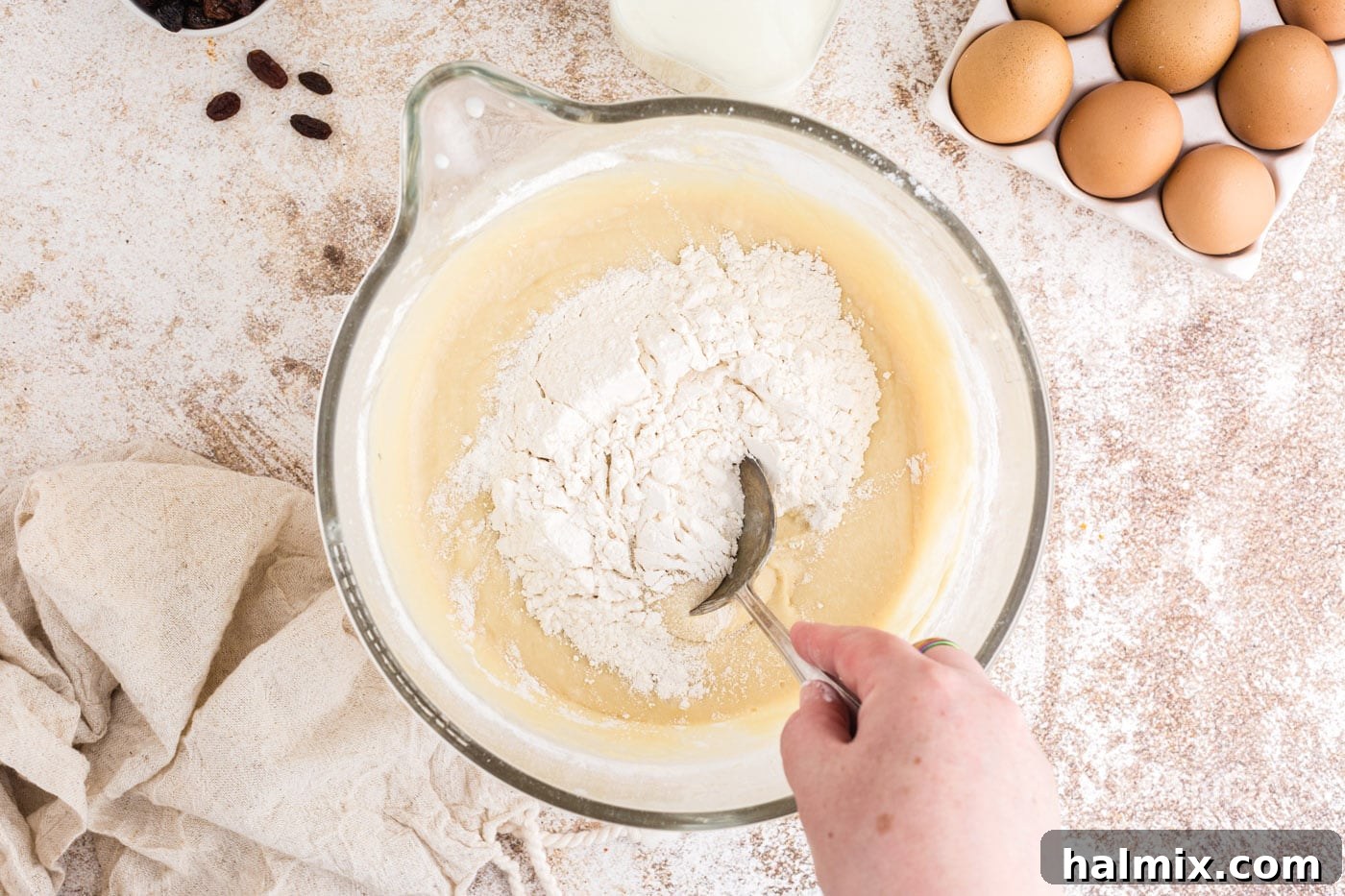 Spiced Easter Delights 9 Stirring additional flour into the dough mixture with a spoon
