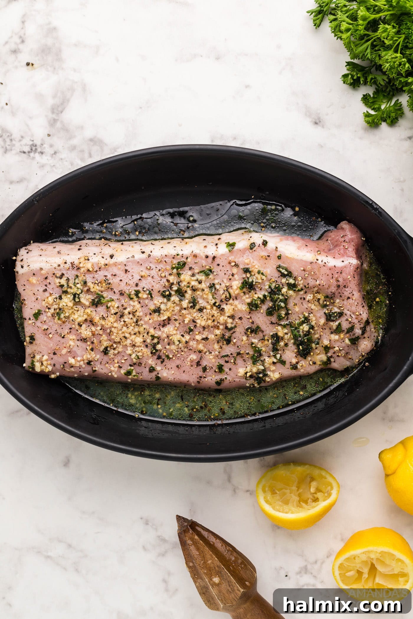 pork tenderloin marinating in a dish