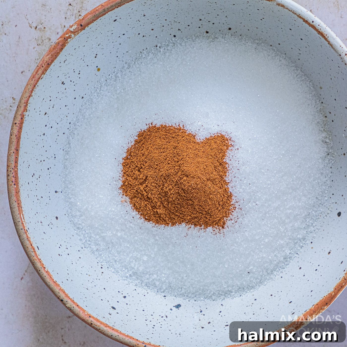 cinnamon and sugar in shallow bowl