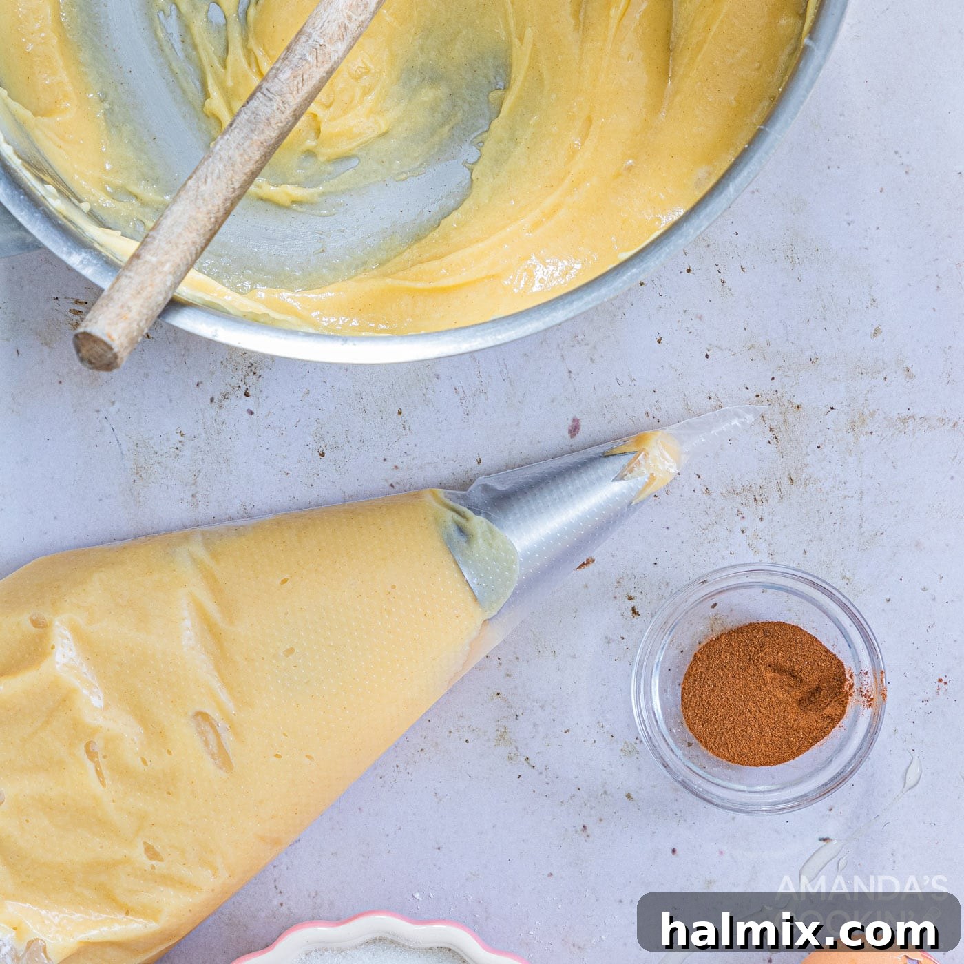 churro dough in a piping bag with tip
