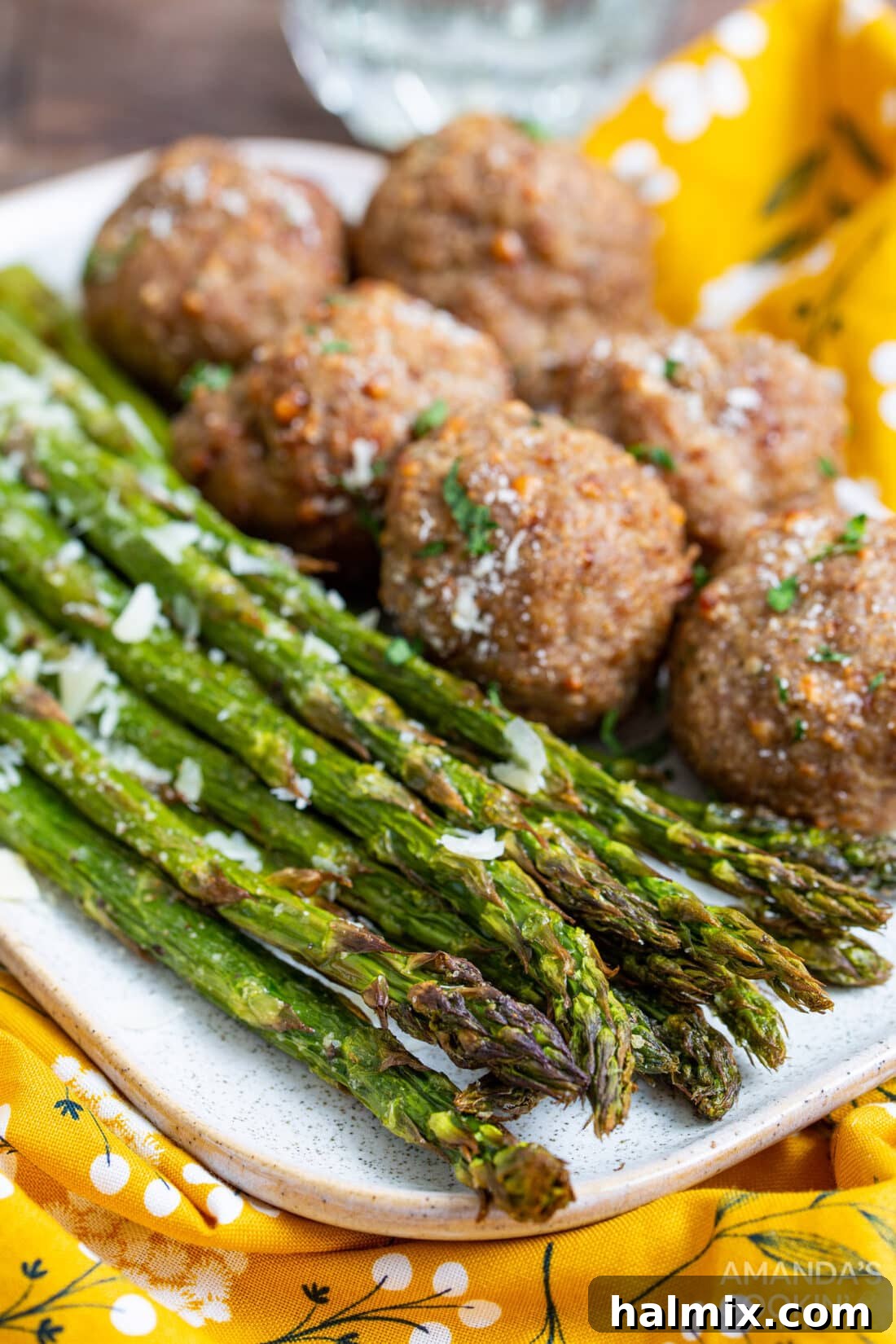Air Fryer Asparagus served alongside savory meatballs for a complete meal