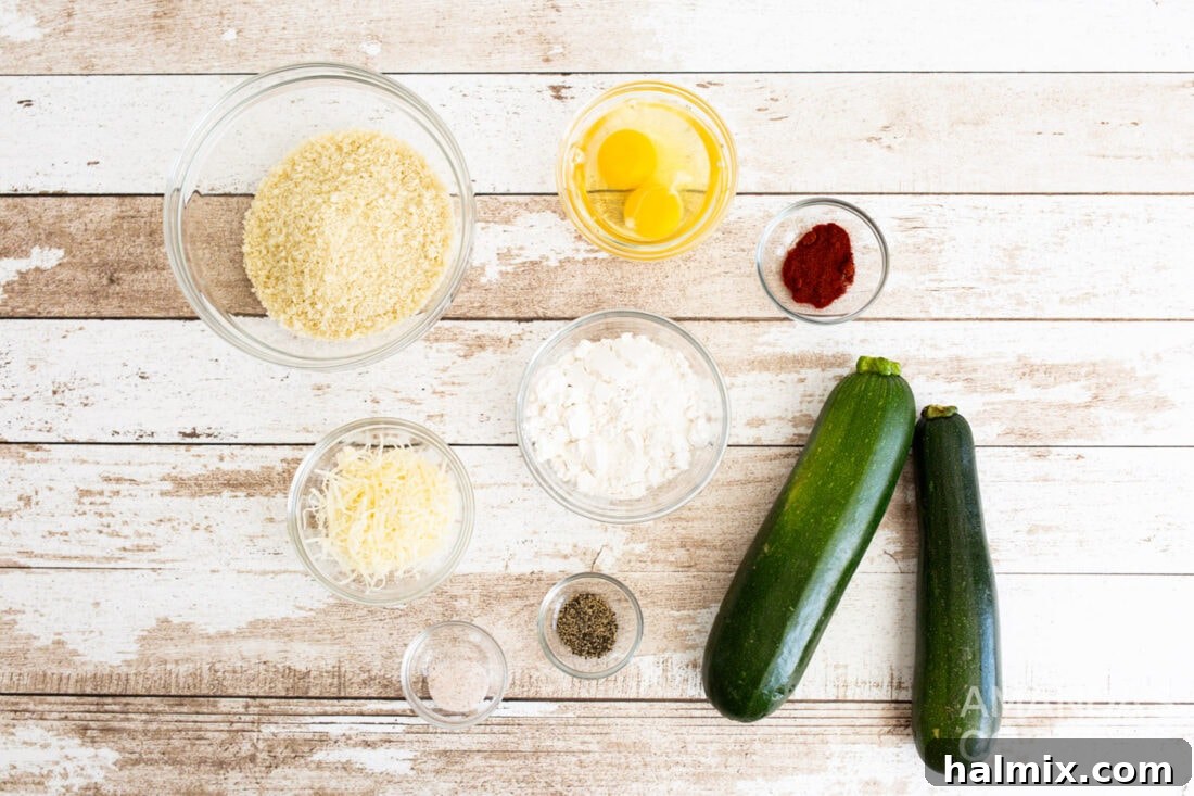 A collection of fresh ingredients for air fryer zucchini fries