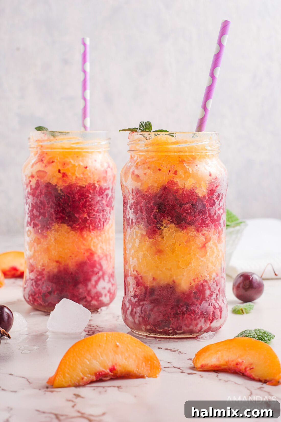 layered cherry peach slushies in jars