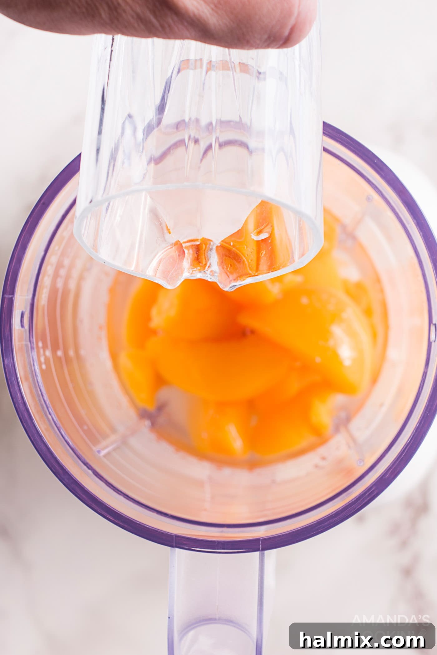 chopped peaches and simple syrup in a blender