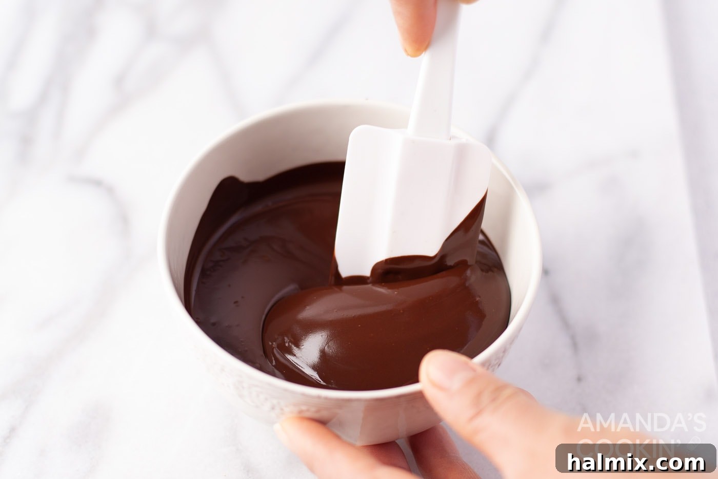 Effortless Cornflake Crunch 5 Smooth, glossy melted chocolate in a stainless steel bowl, ready for the next step.