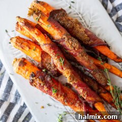 candied bacon wrapped carrots on a plate