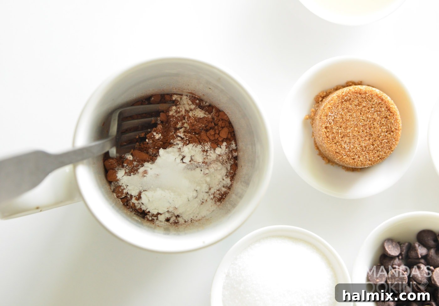 Dry ingredients for mug cake mixed in a mug.
