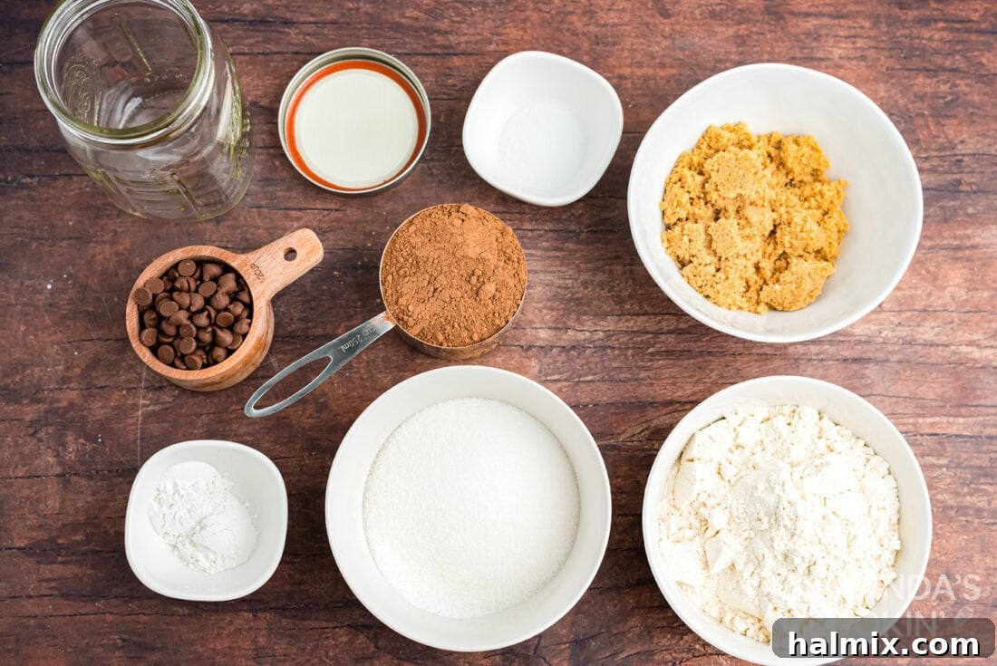 Ingredients for chocolate mug cake mix layered in a jar for easy gifting.