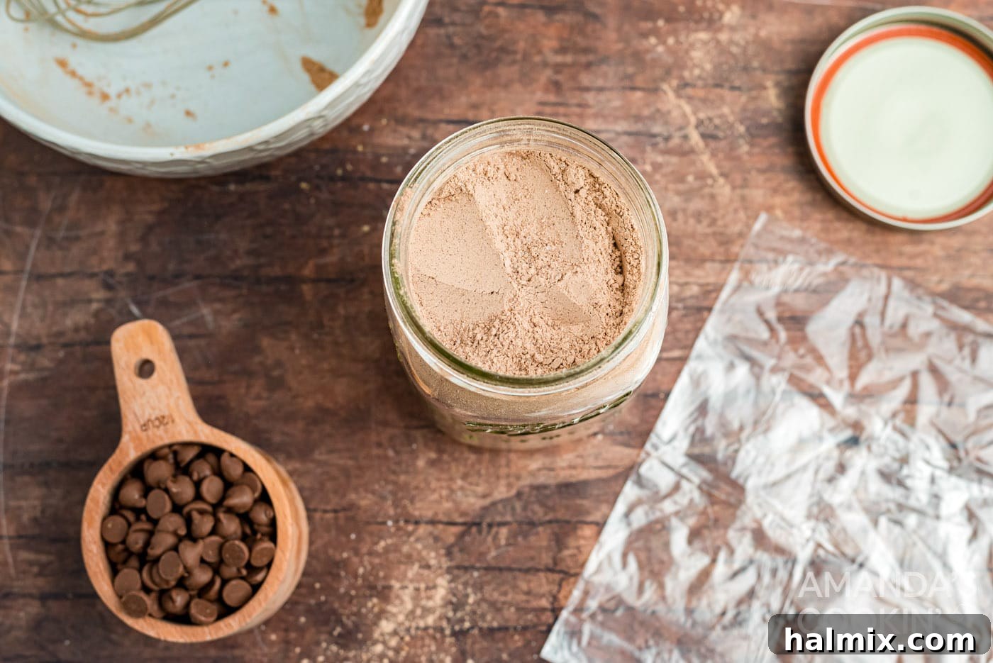 Dry ingredients neatly layered inside a mason jar for mug cake mix.
