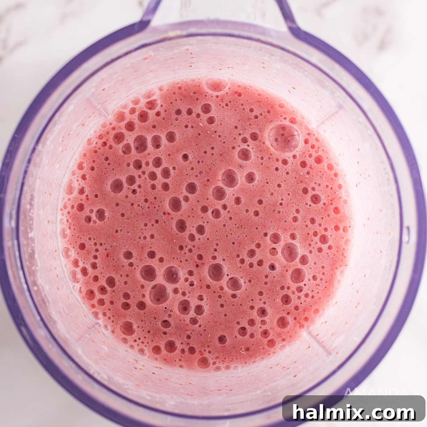 strawberry banana fizzy float mixture in a blender