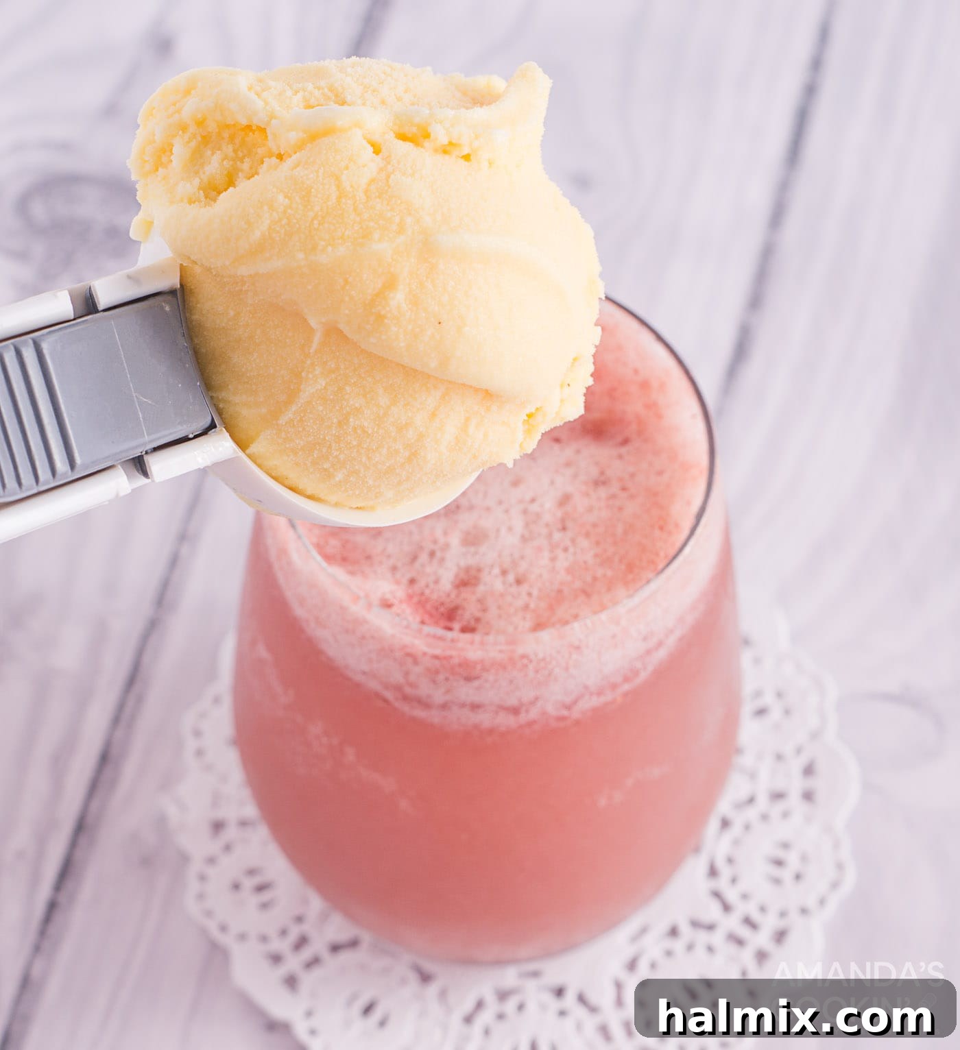 scoop of vanilla ice cream over strawberry banana float