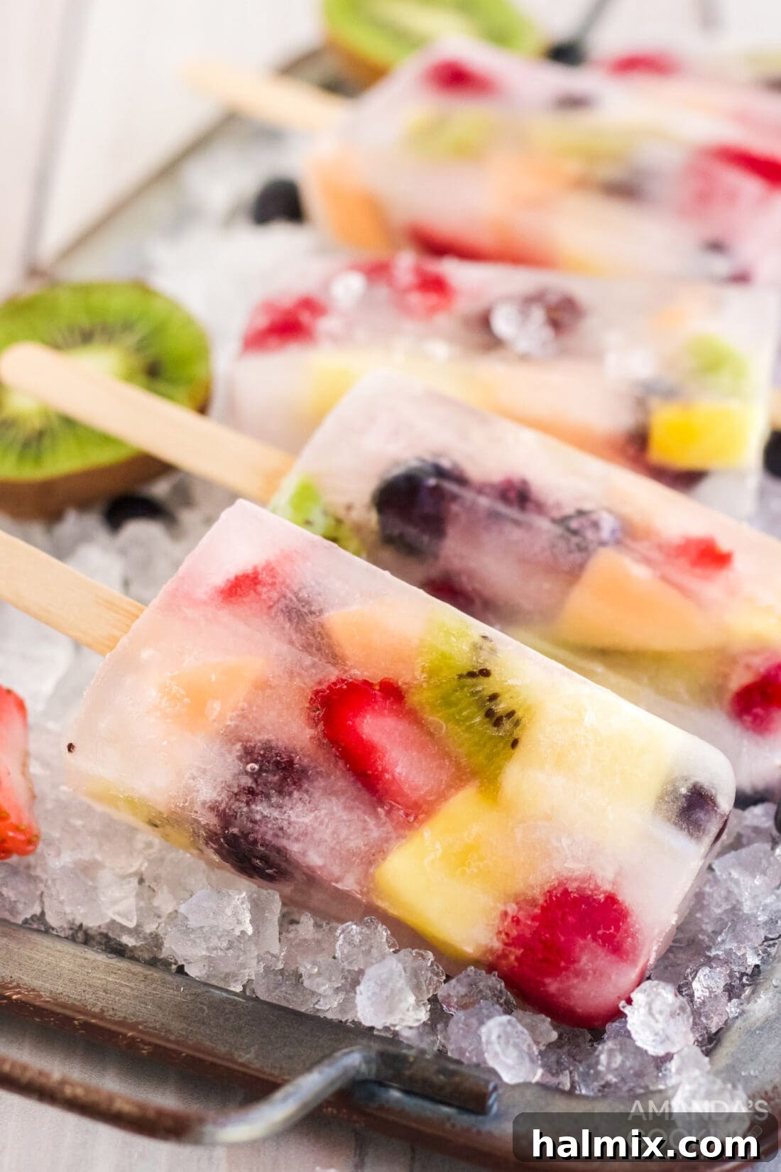 Summer Fruit Delights 2 Vibrant homemade fruit popsicles arranged on a bed of ice