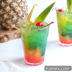 Blue Hawaiian Mai Tai cocktail in a glass with garnishes.