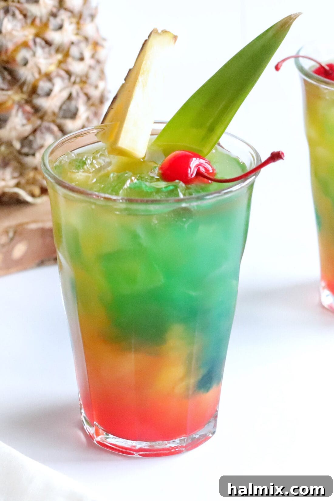 Close up photo of a stunning Blue Hawaiian Mai Tai, showcasing its vibrant colors and inviting texture.