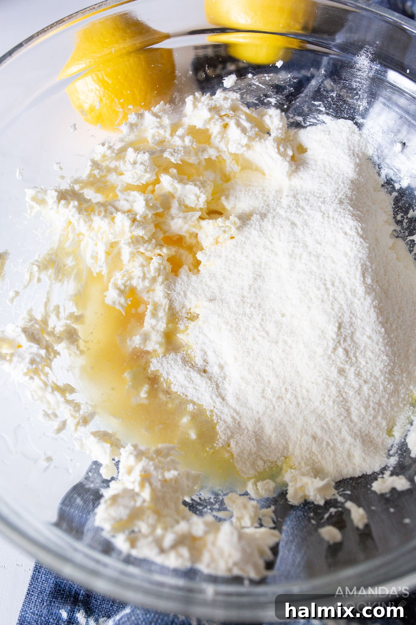 Refreshing Lemon Icebox Cake 6 lemon pudding powder, softened cream cheese, vanilla extract, and lemon juice combined in a bowl