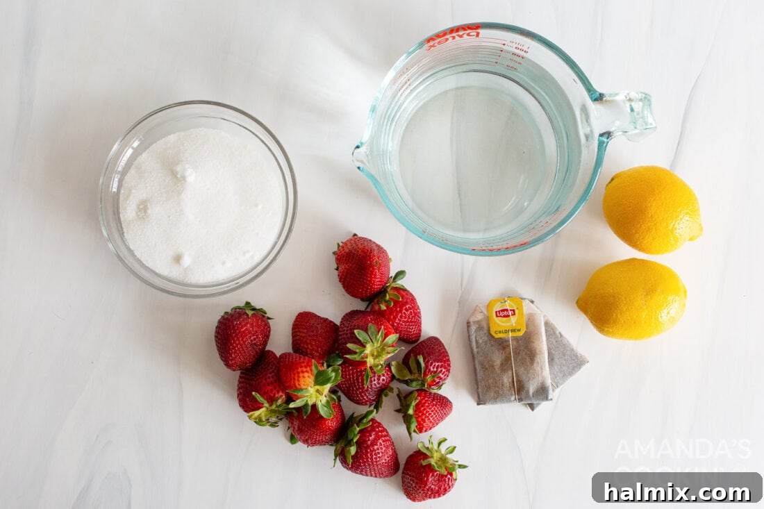 Ingredients laid out for strawberry sweet tea including fresh strawberries, sugar, tea bags, and lemons