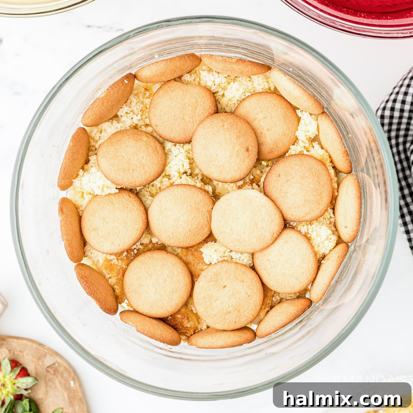 Vanilla wafers layered on top of cake in a trifle bowl