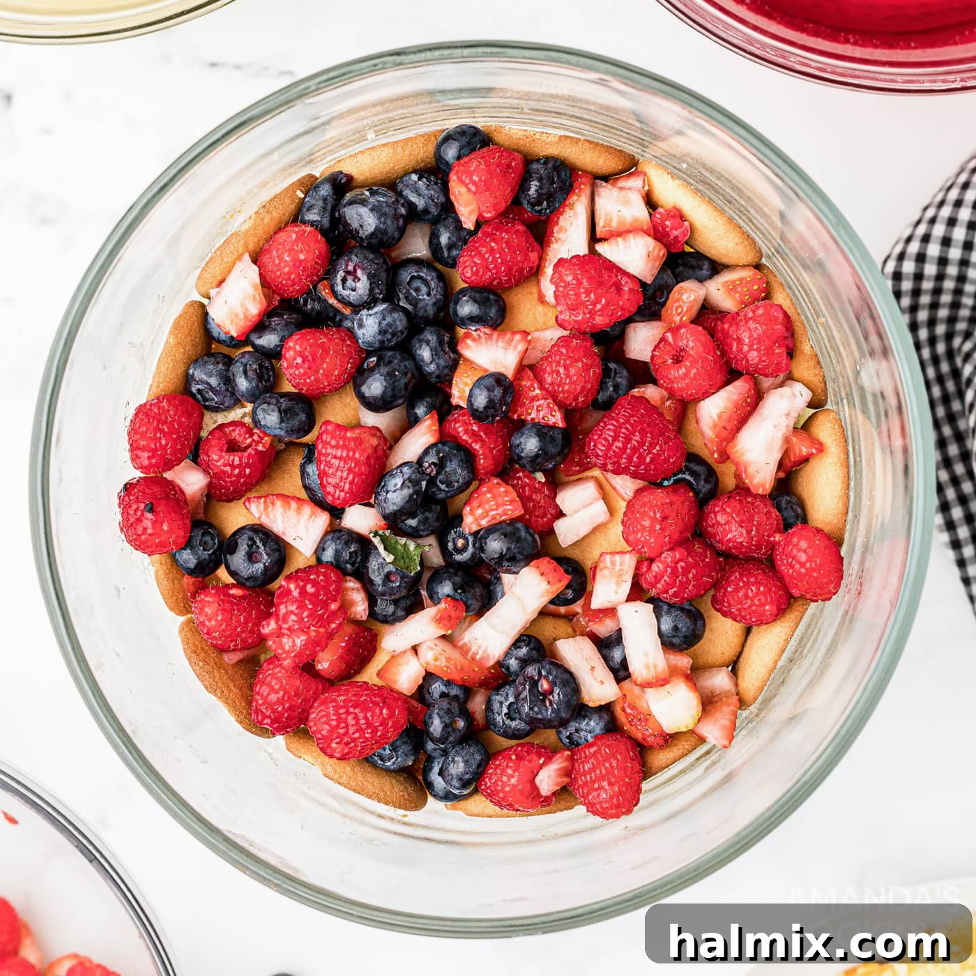 Rainbow Jello Dessert 8 Chopped fruit layered over wafers and cake in a trifle