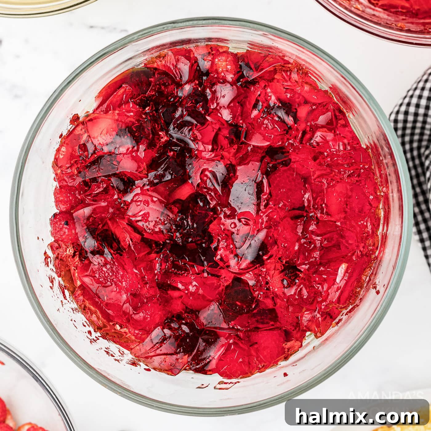 Jell-O layer on top of fruit in a trifle bowl