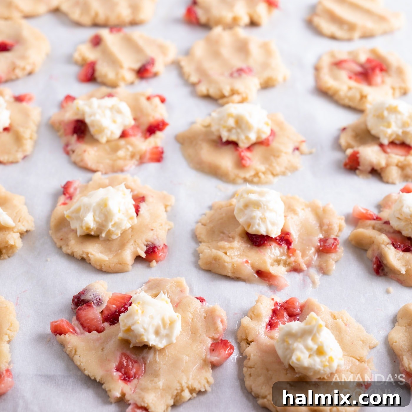 cream cheese balls on top of cookie dough